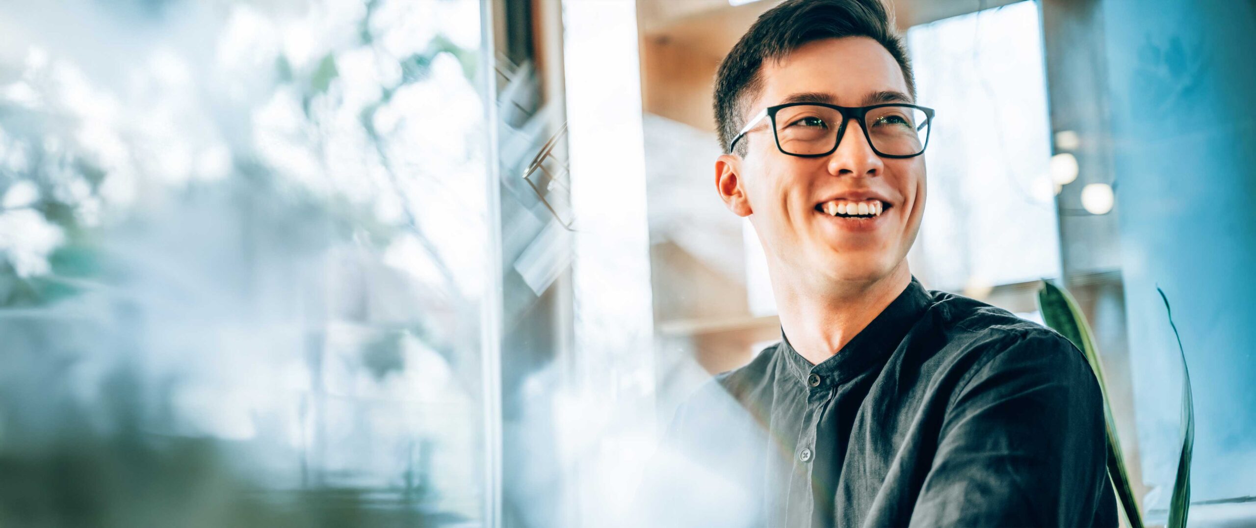 Man smiling at desk