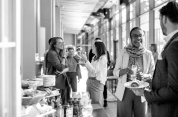 People gather in reception with food