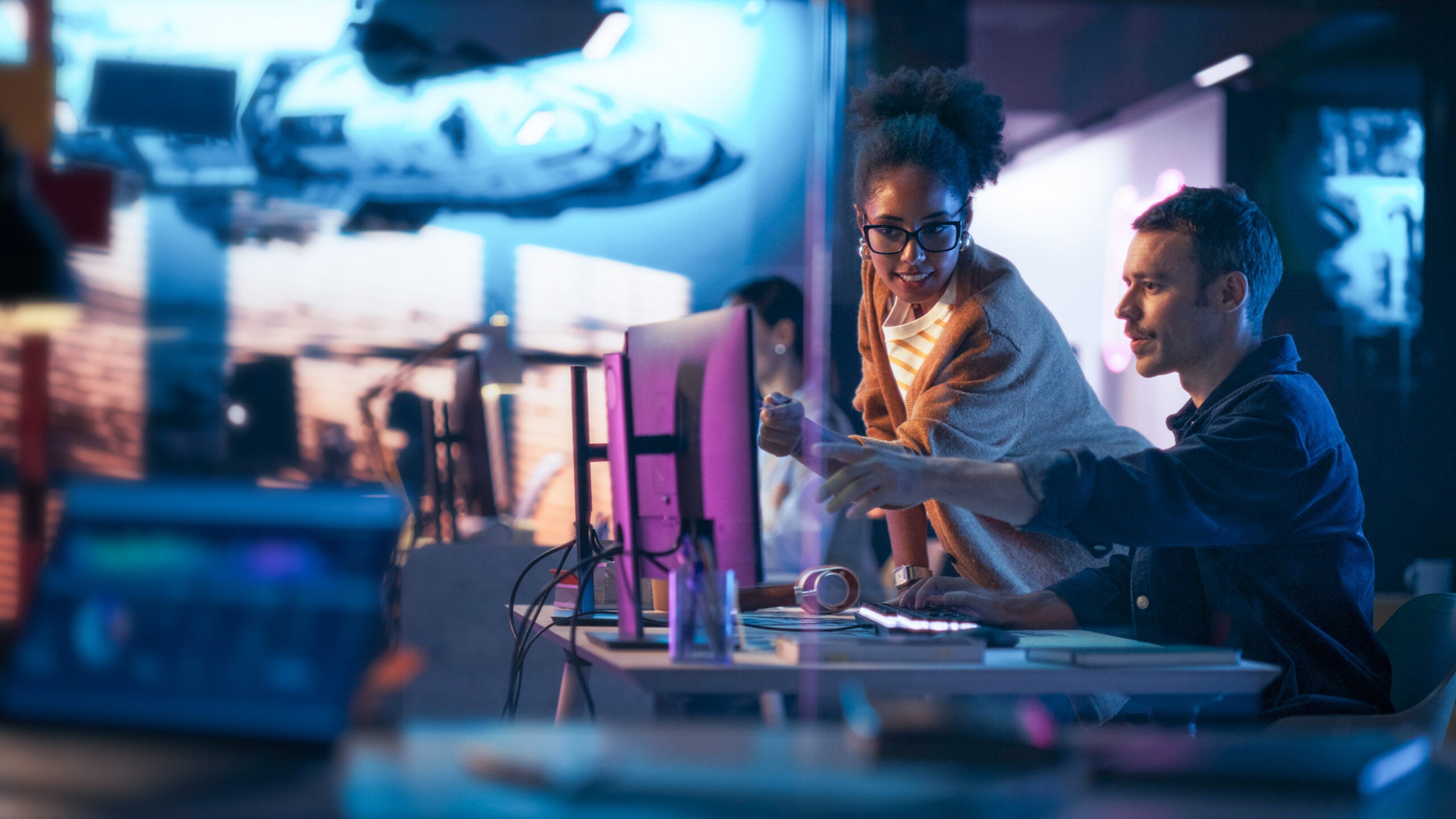 AI generated image of man and woman working at computer