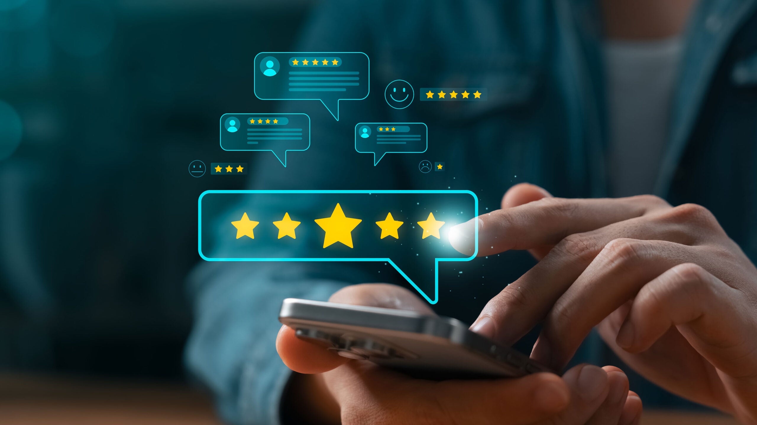 Hand using phone to leave a review