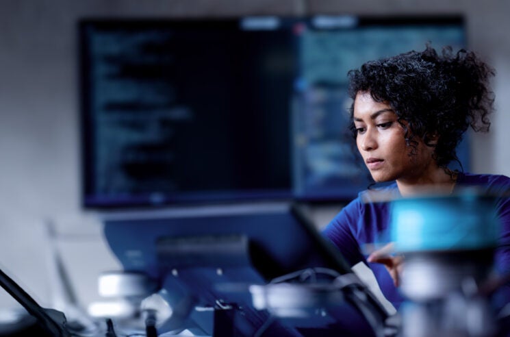 AI generated image of woman in IT computing lab