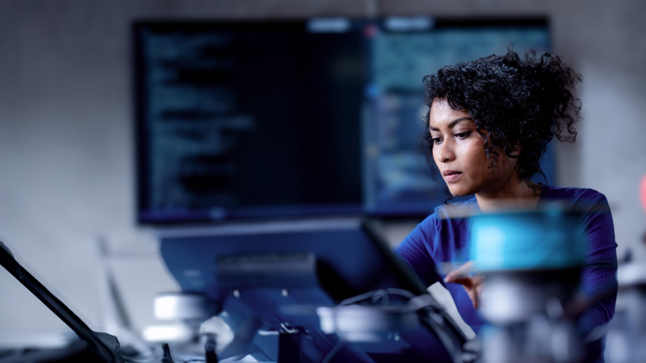 AI generated image of woman in IT computing lab